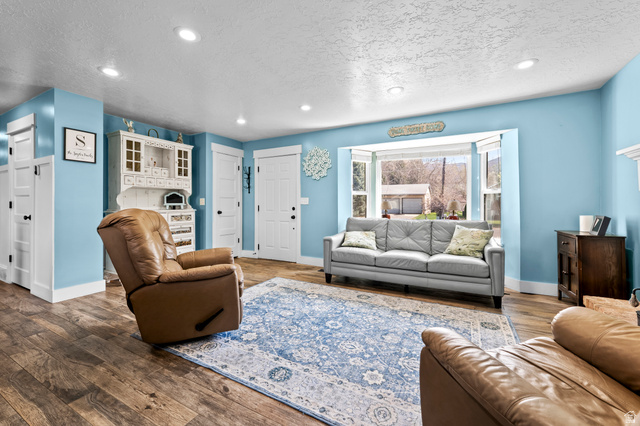 141 North 600 East Mapleton, UT 84664 - Photo 11 of 44 Living room featuring recessed lighting, hardwood / wood-style floors, and a textured ceiling