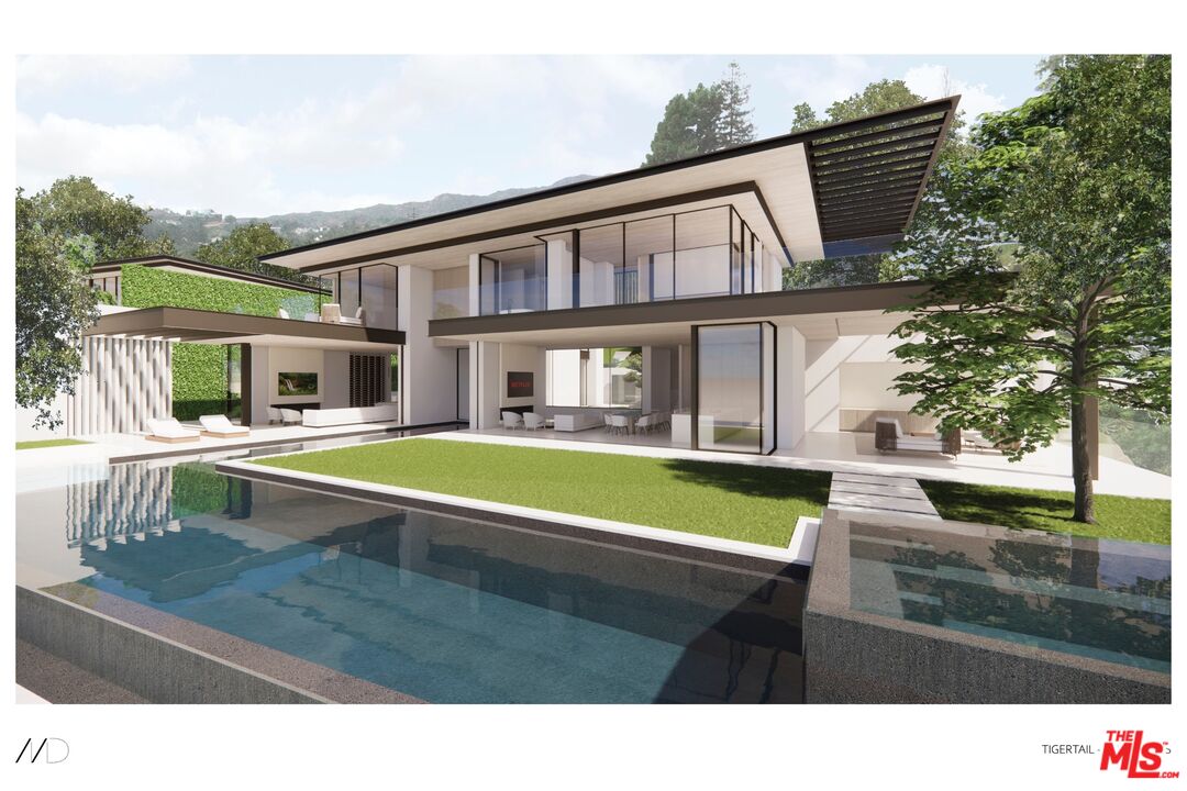 741 North Tigertail Road Los Angeles, CA 90049 - Photo 8 of 14 a swimming pool with outdoor seating and yard