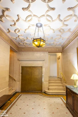 a view of a fireplace door and wooden floor