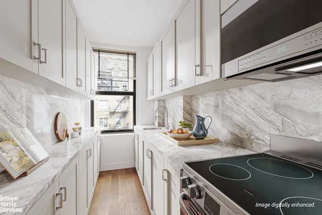 a kitchen with a sink stove top oven and cabinets