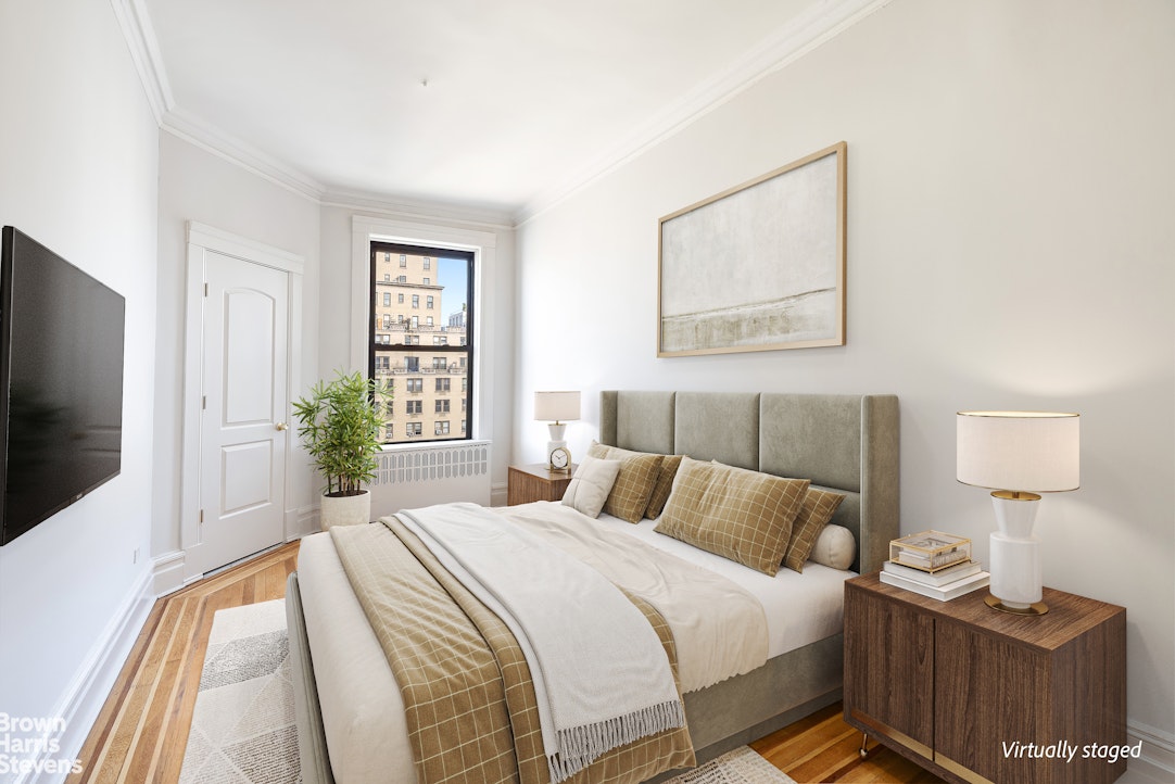 640 West End Avenue, Unit 12C Manhattan, NY 10024 - Photo 8 of 17 a bedroom with a bed and a flat screen tv