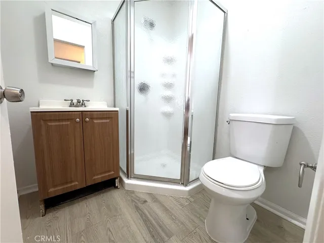 a view of a livingroom with wooden floor
