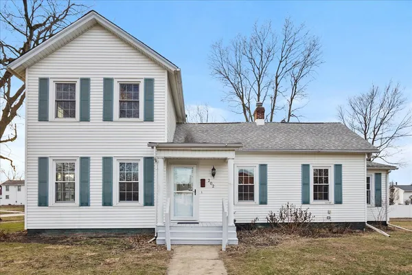 a front view of a house with a yard