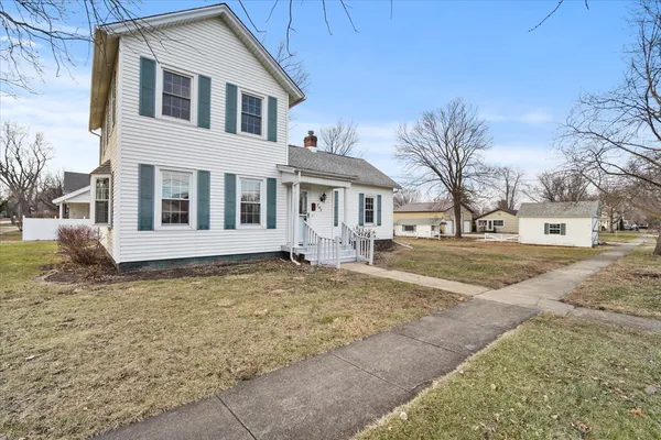 a front view of a house with a yard