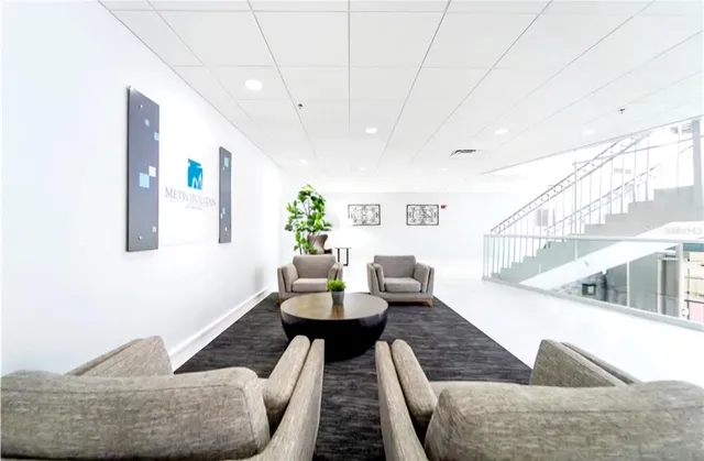 a view of hallway with wooden floor