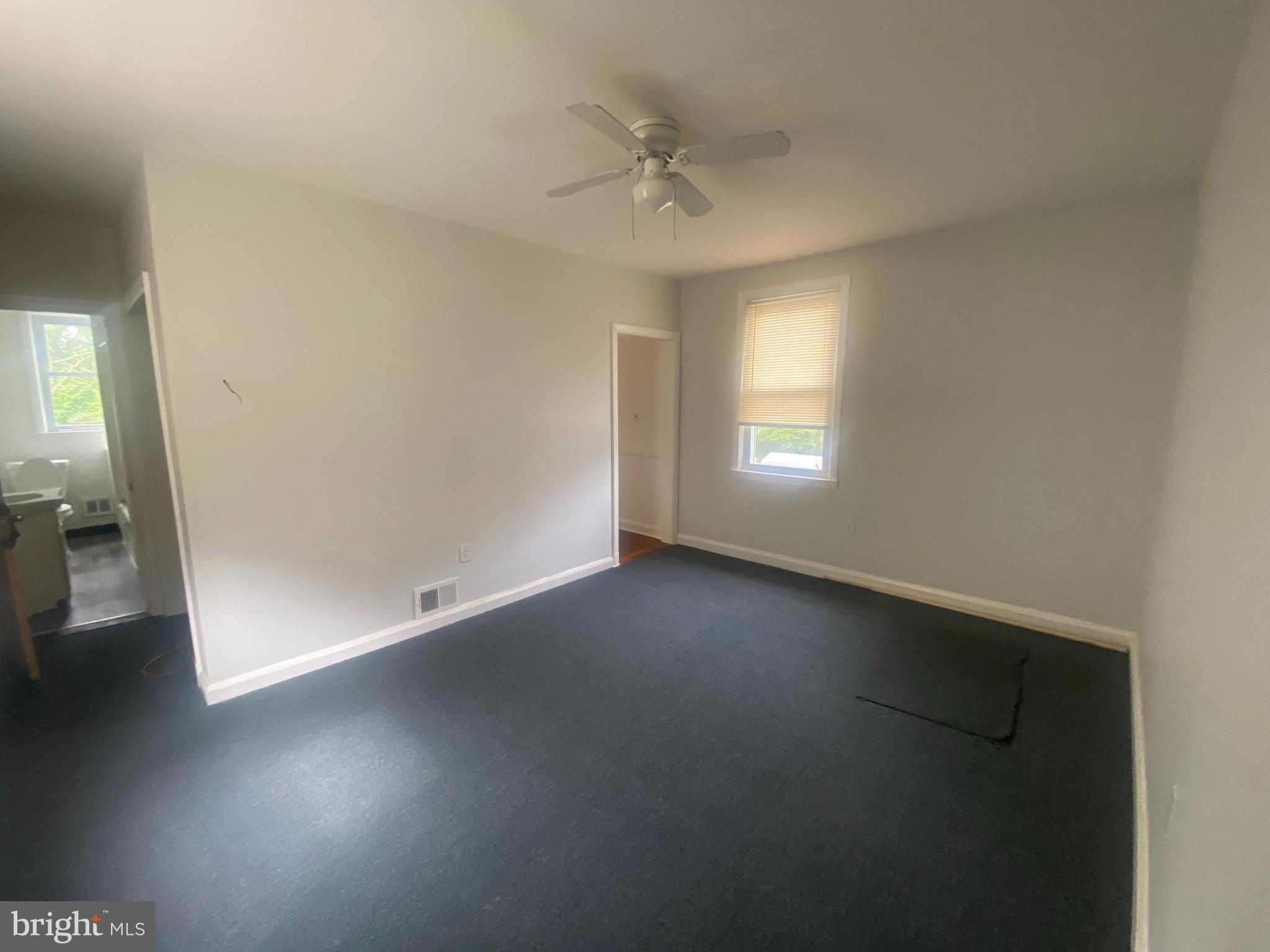 3305 Rosekemp Avenue Baltimore, MD 21214 - Photo 4 of 5 wooden floor in an empty room with a window