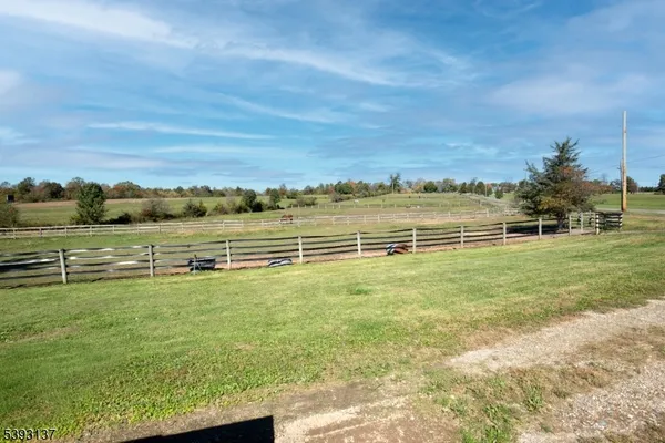 a view of a field with an ocean