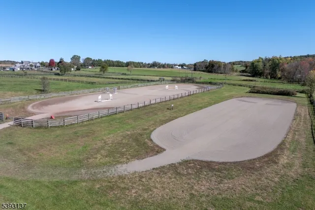 a view of a yard with wooden fence