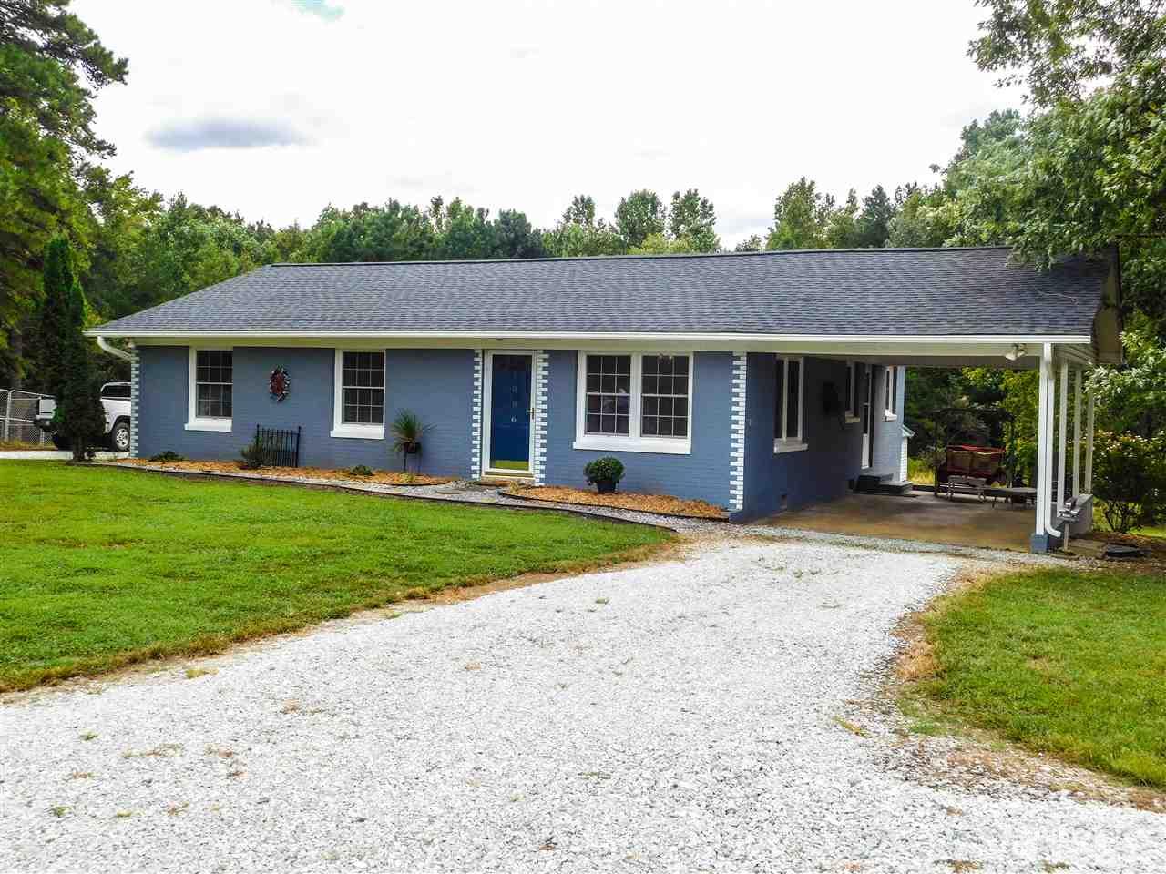 1096 Gillis Road Roxboro, NC 27574 - Photo 1 of 16 a front view of house with yard and green space