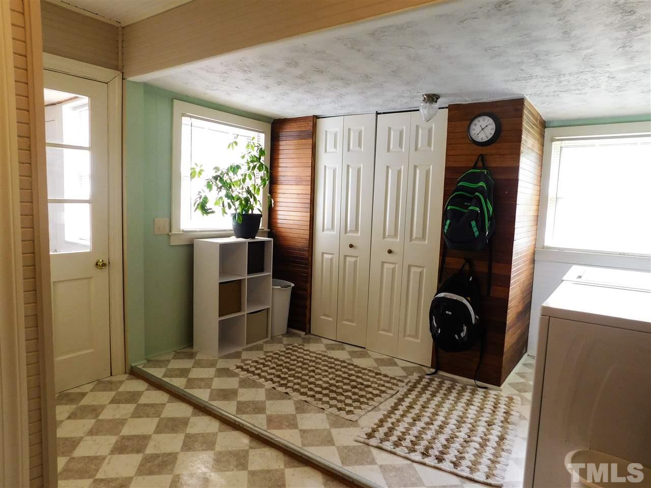 1096 Gillis Road Roxboro, NC 27574 - Photo 14 of 16 a view of a door and chair in a room