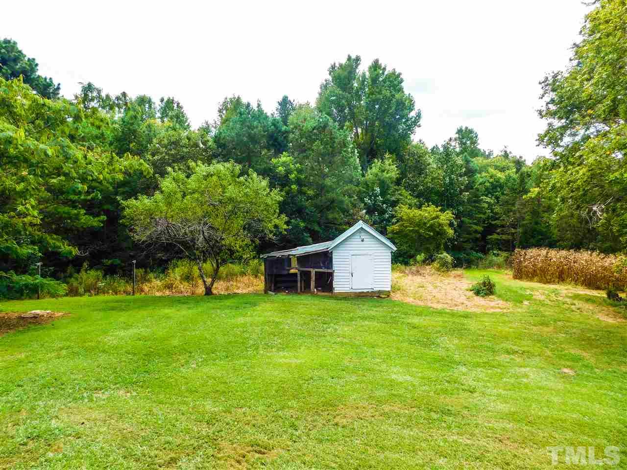 1096 Gillis Road Roxboro, NC 27574 - Photo 16 of 16 a view of a house with a yard