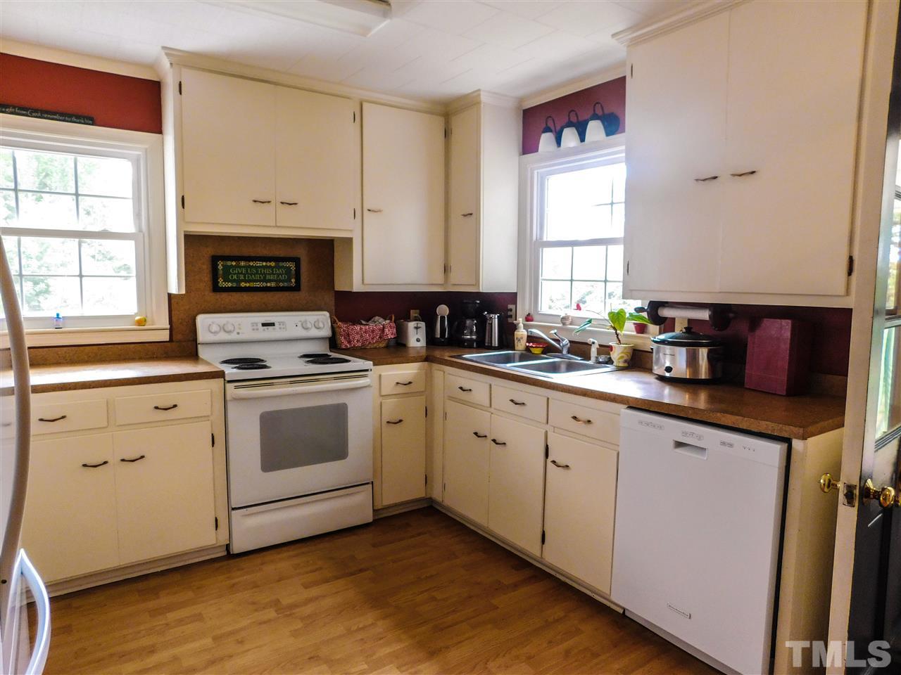1096 Gillis Road Roxboro, NC 27574 - Photo 6 of 16 a kitchen with a stove a sink and a microwave
