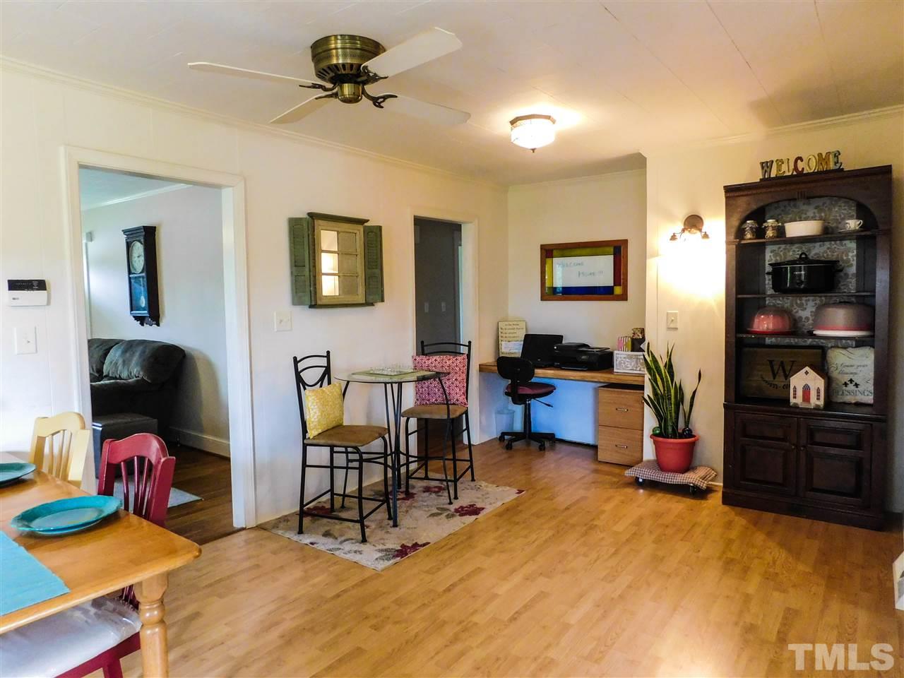 1096 Gillis Road Roxboro, NC 27574 - Photo 7 of 16 a view of a workspace with furniture and closet