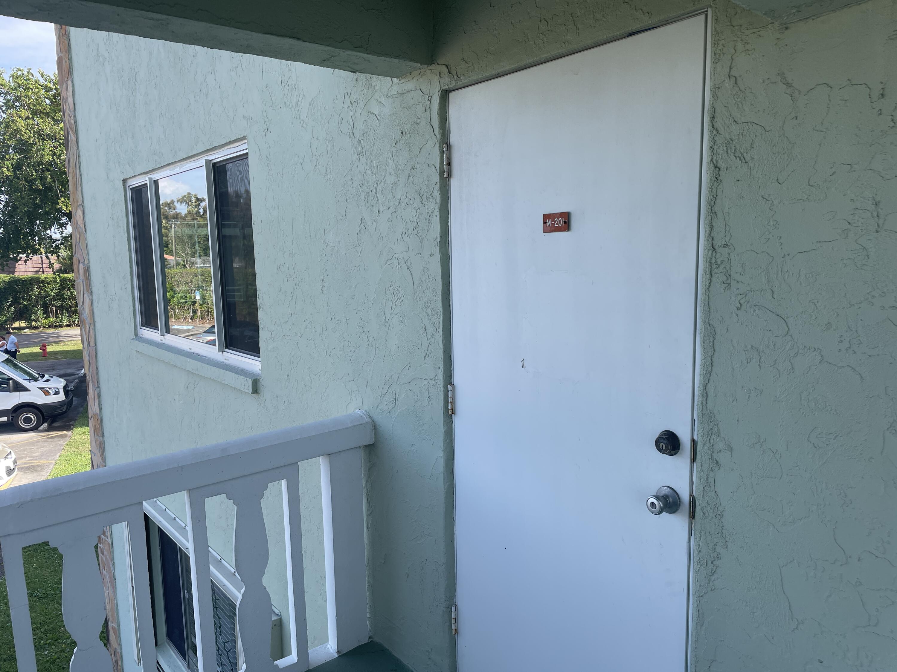 3300 Springdale Boulevard, Unit 201 Palm Springs, FL 33461 - Photo 2 of 49 a view of front door