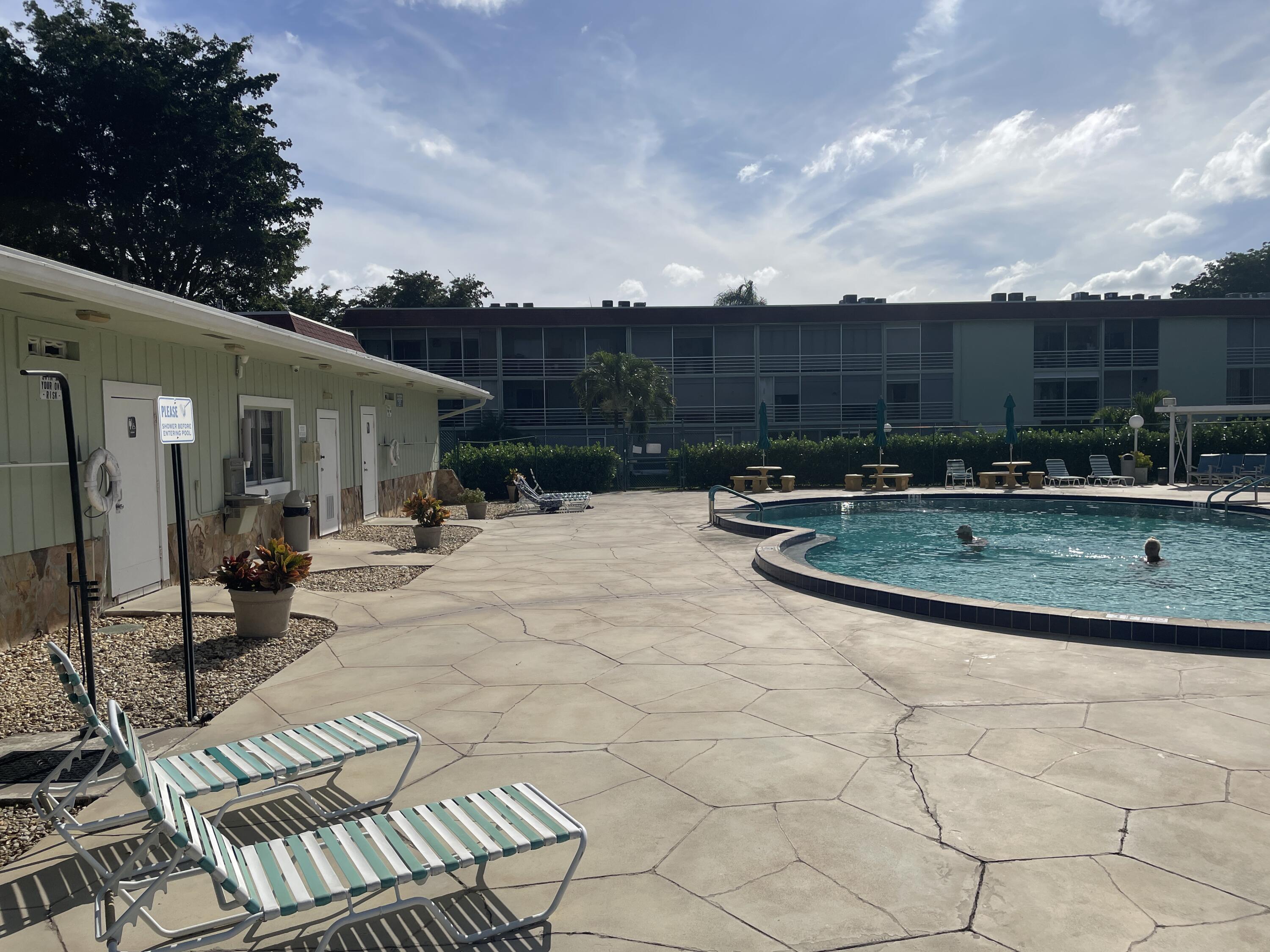 3300 Springdale Boulevard, Unit 201 Palm Springs, FL 33461 - Photo 24 of 49 a view of a backyard with sitting area