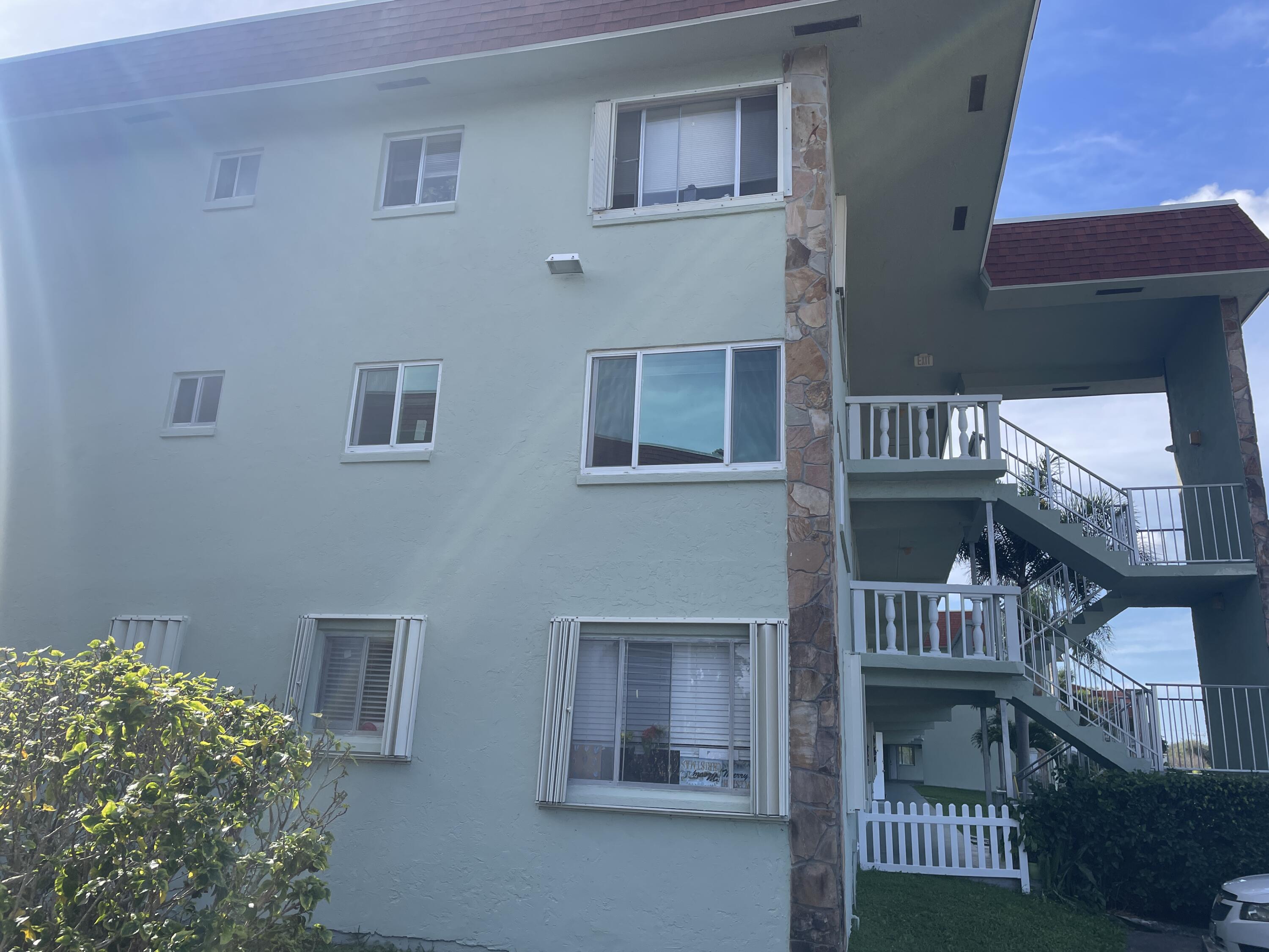 3300 Springdale Boulevard, Unit 201 Palm Springs, FL 33461 - Photo 3 of 49 a view of front of a house with a porch