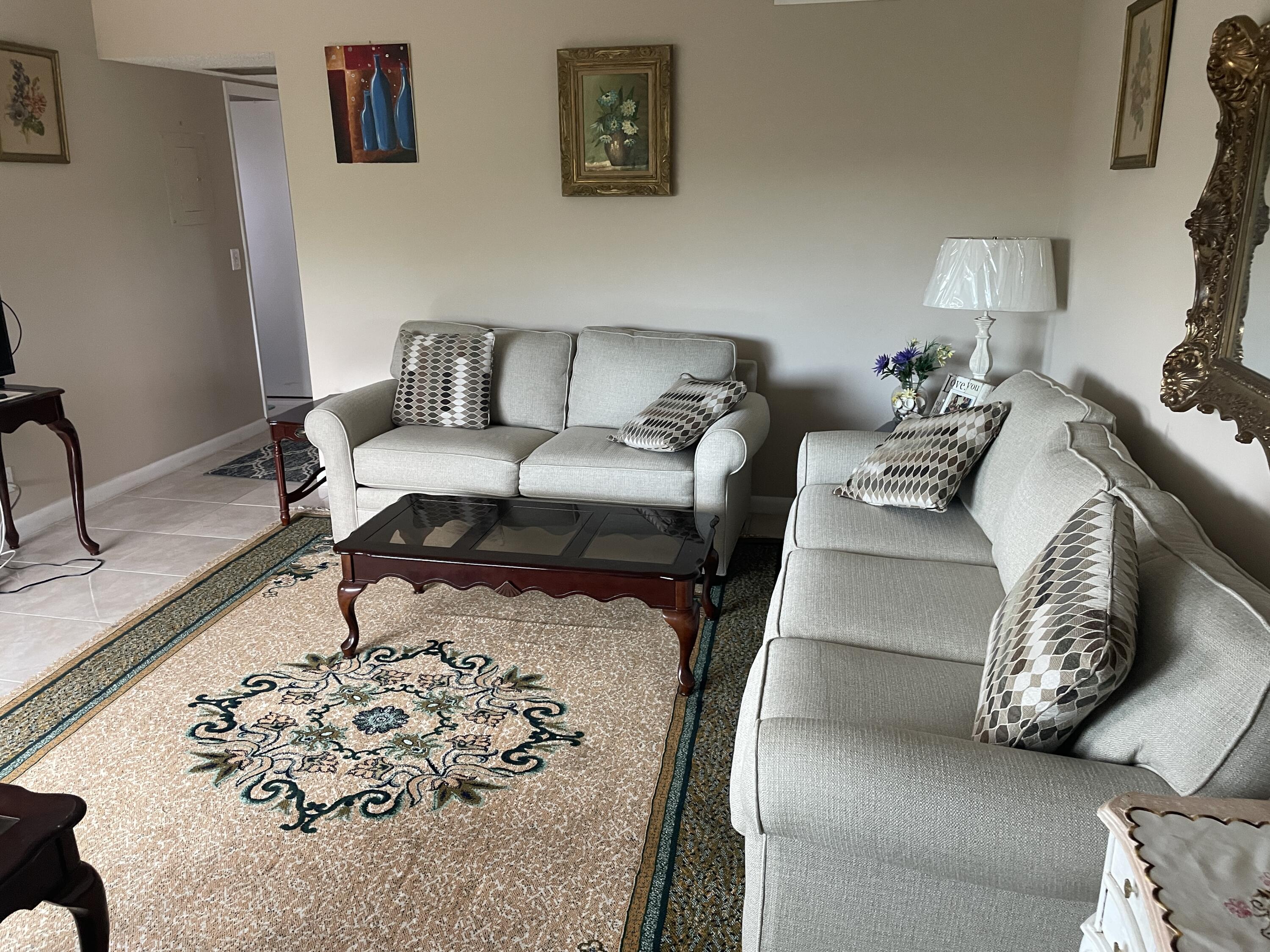 3300 Springdale Boulevard, Unit 201 Palm Springs, FL 33461 - Photo 37 of 49 a living room with furniture and a couch