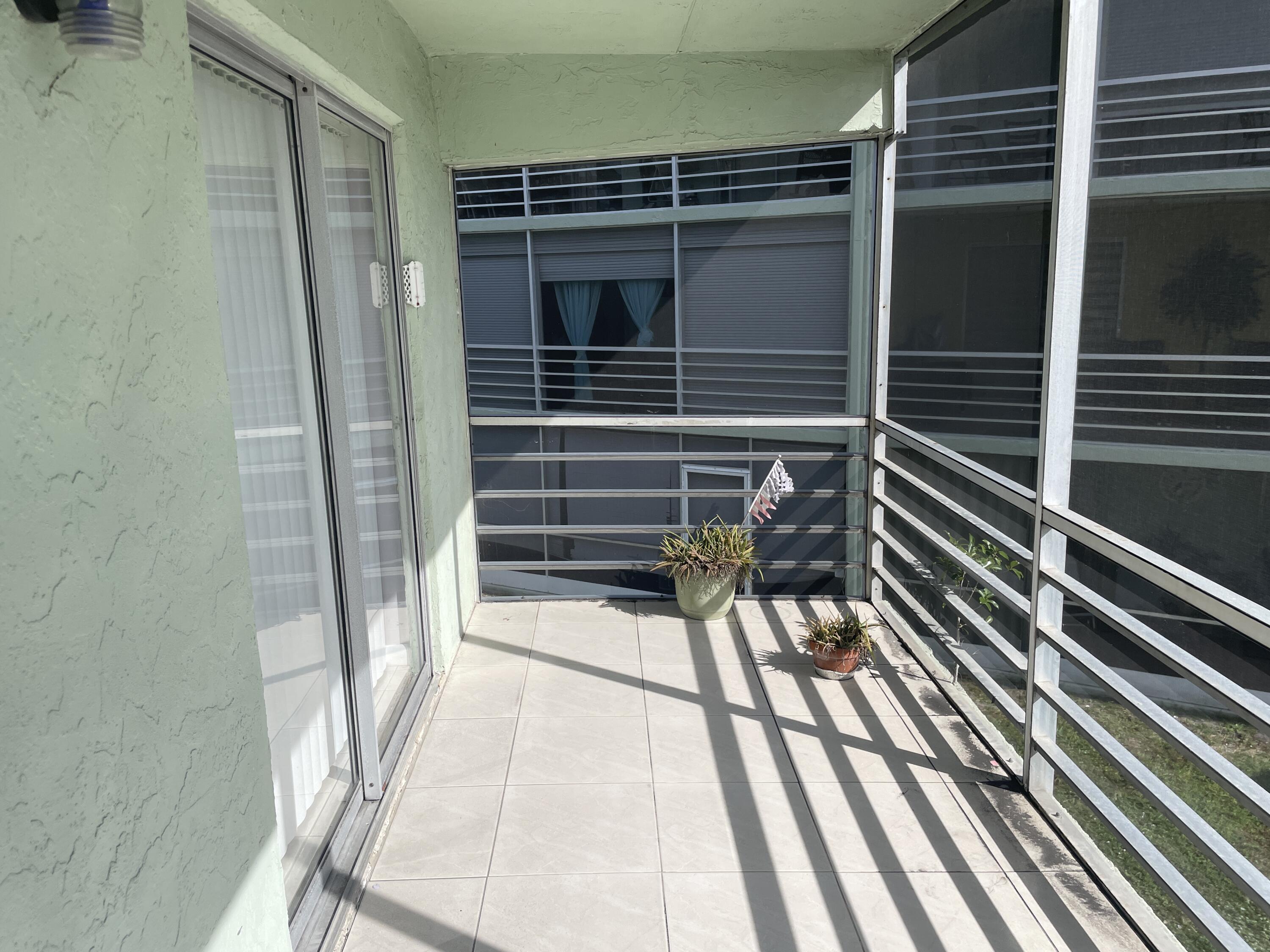 3300 Springdale Boulevard, Unit 201 Palm Springs, FL 33461 - Photo 7 of 49 a view of outdoor space