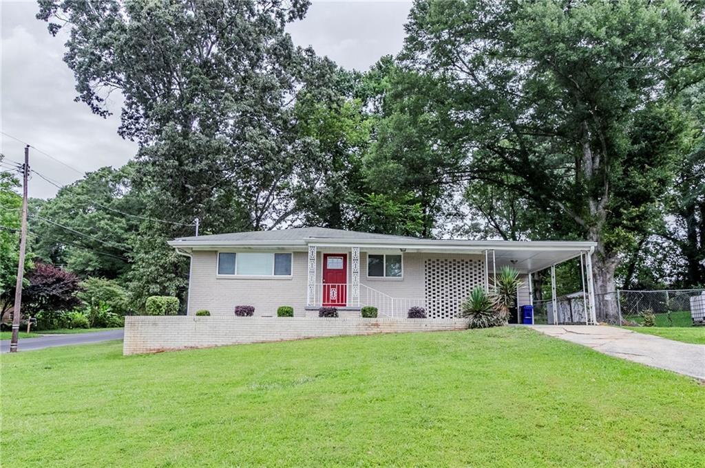 1982 Yucca Drive Decatur, GA 30032 - Photo 1 of 1 a front view of house with yard and green space