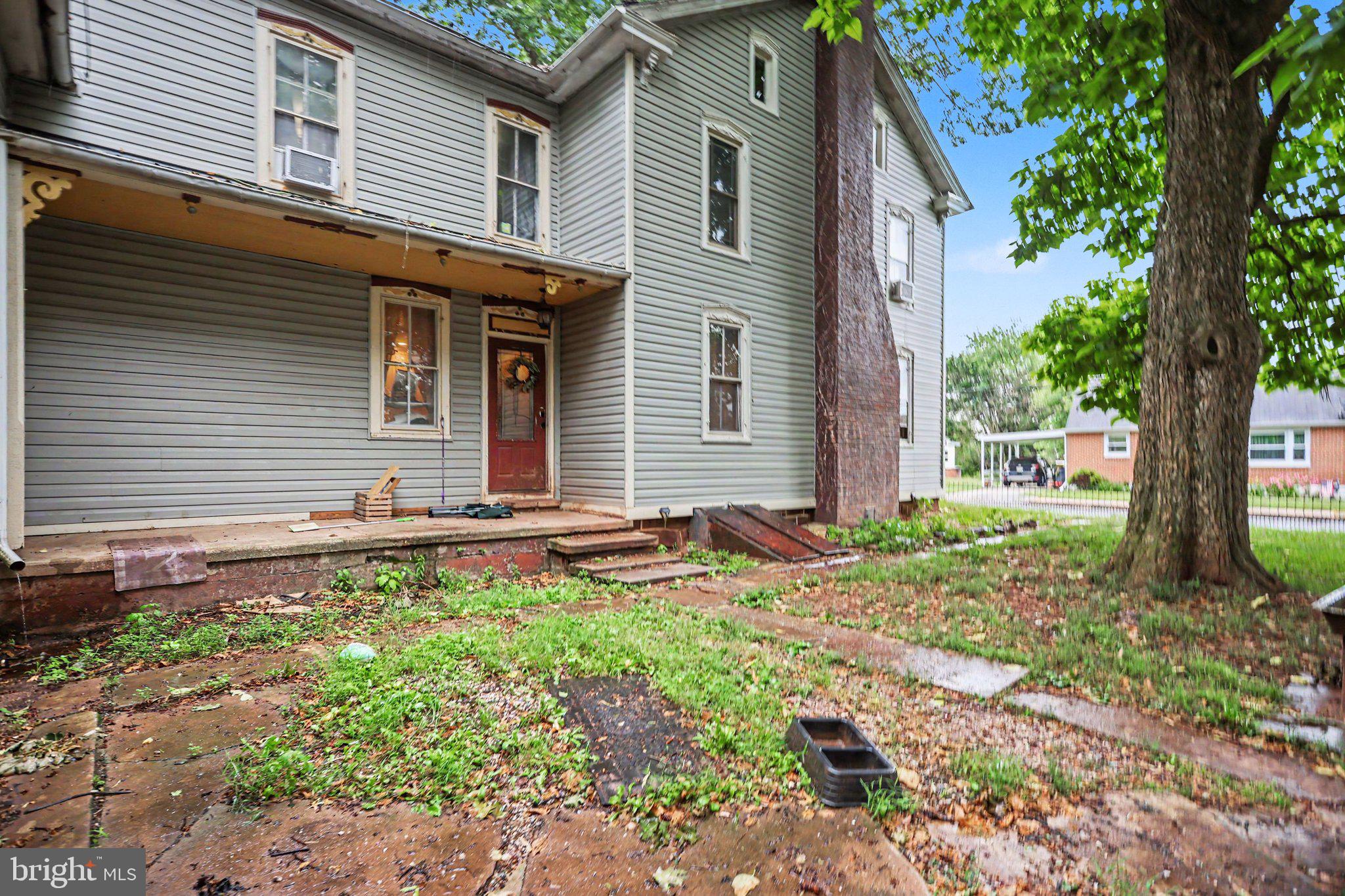 61 Mayfield Street Dover, PA 17315 - Photo 4 of 26 Charming home with lush greenery.