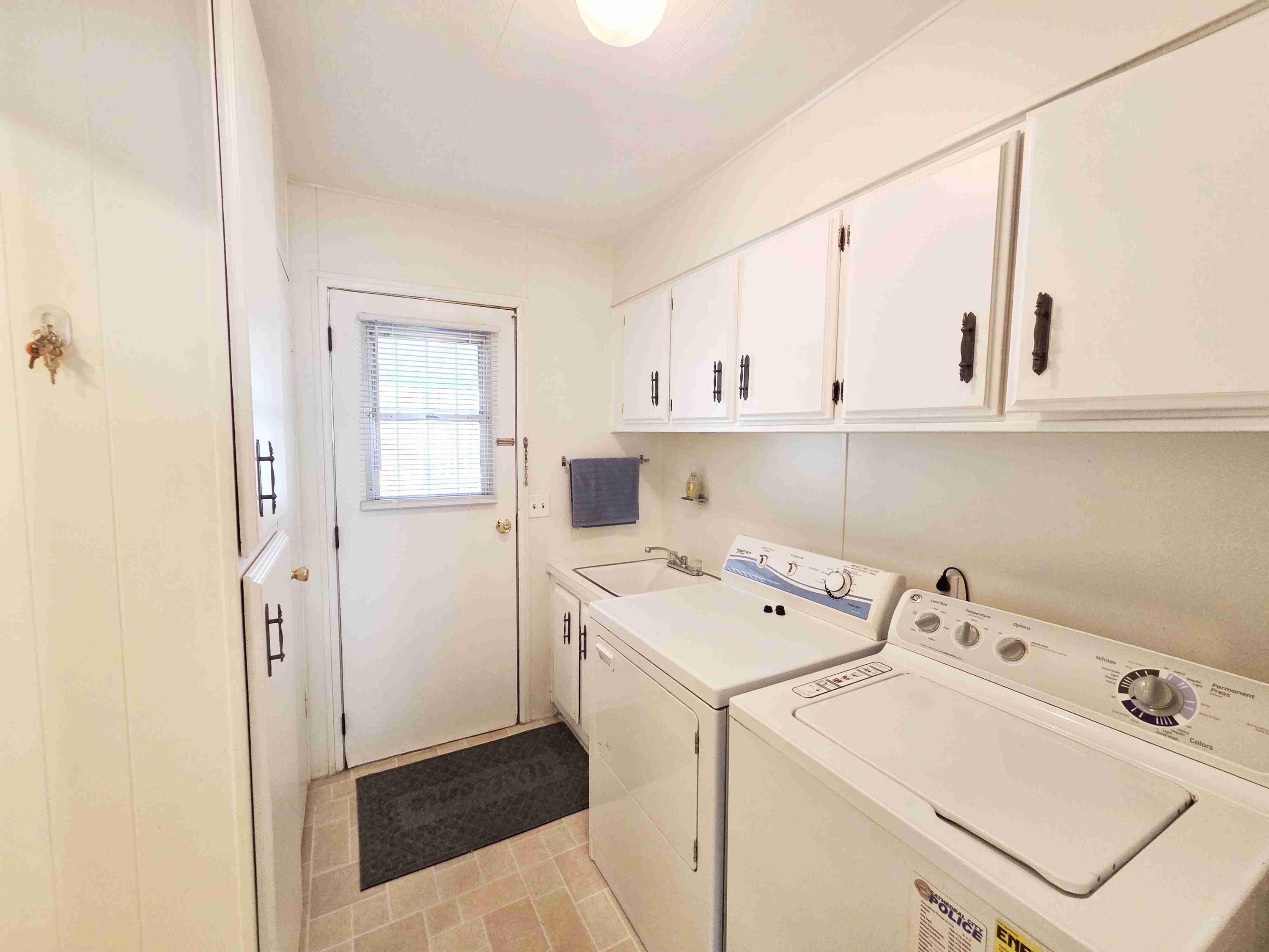 362 Buffalo Road Cathedral City, CA 92234 - Photo 11 of 15 a view of utility room with washer and dryer