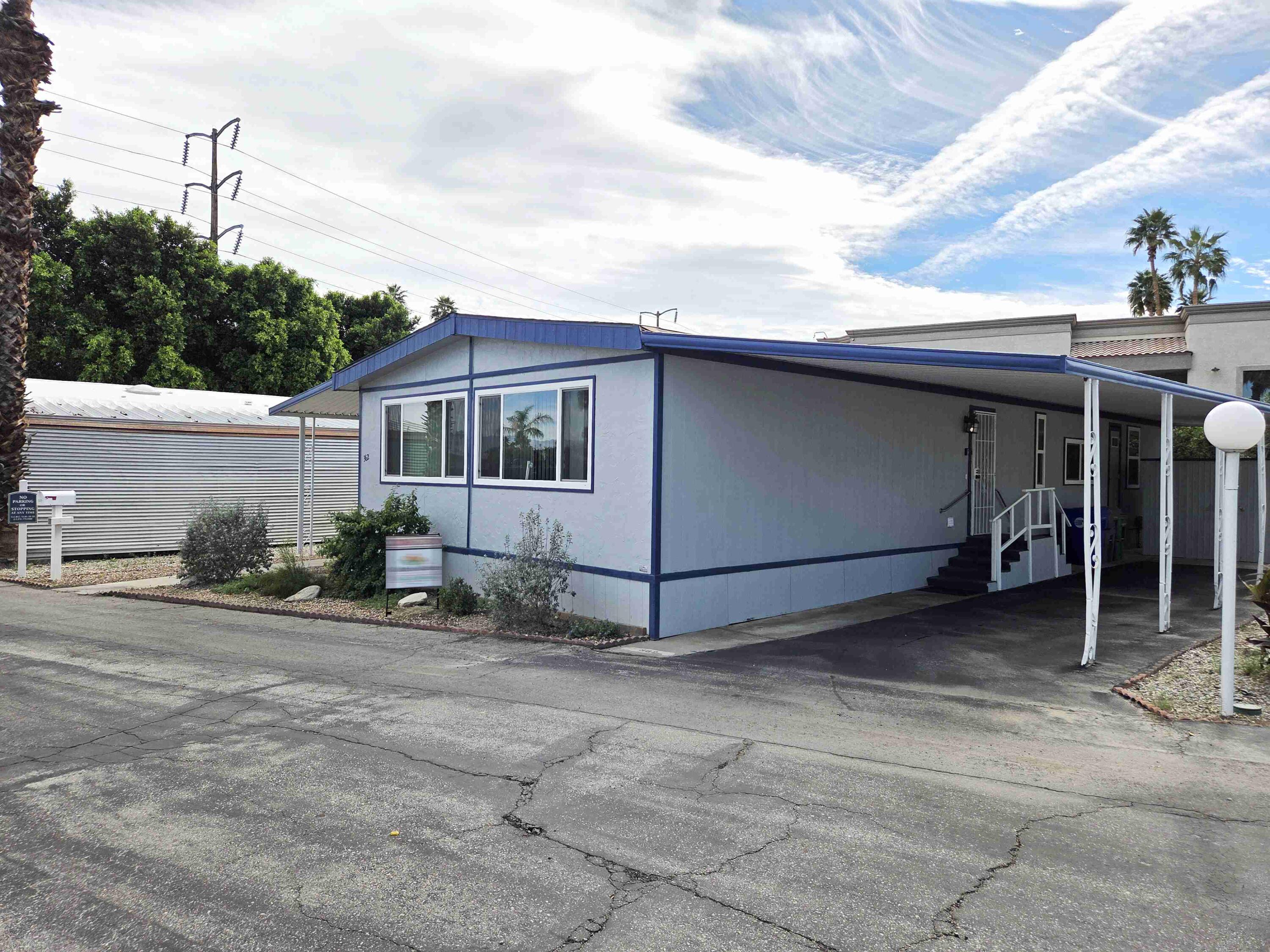 362 Buffalo Road Cathedral City, CA 92234 - Photo 3 of 15 a white house with a outdoor space