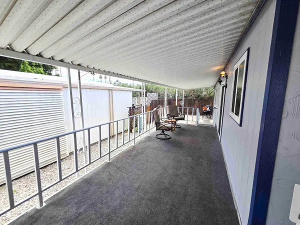 a view of hallway with furniture