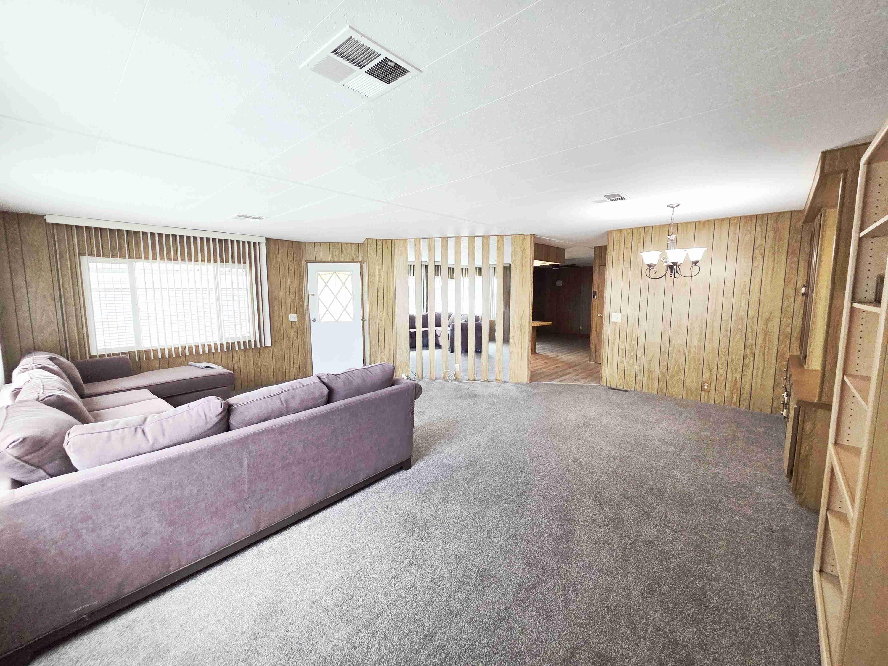 362 Buffalo Road Cathedral City, CA 92234 - Photo 7 of 15 a living room with furniture and a fireplace