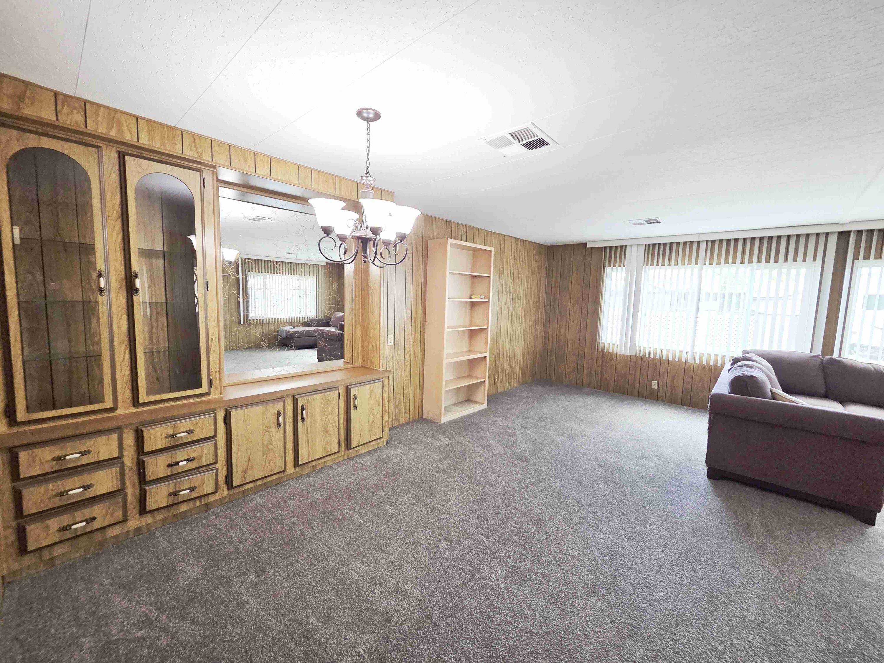362 Buffalo Road Cathedral City, CA 92234 - Photo 8 of 15 a living room with furniture and a large window