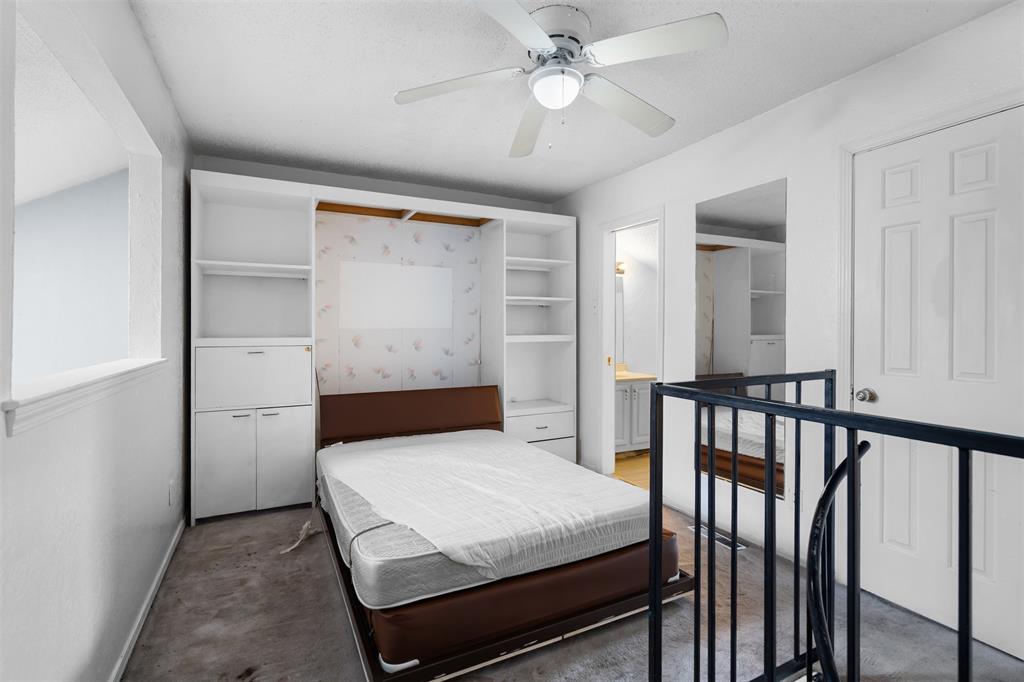 5590 Spring Valley Road, Unit H 203 Dallas, TX 75254 - Photo 24 of 27 Built-in shelving and cabinetry provide integrated storage
