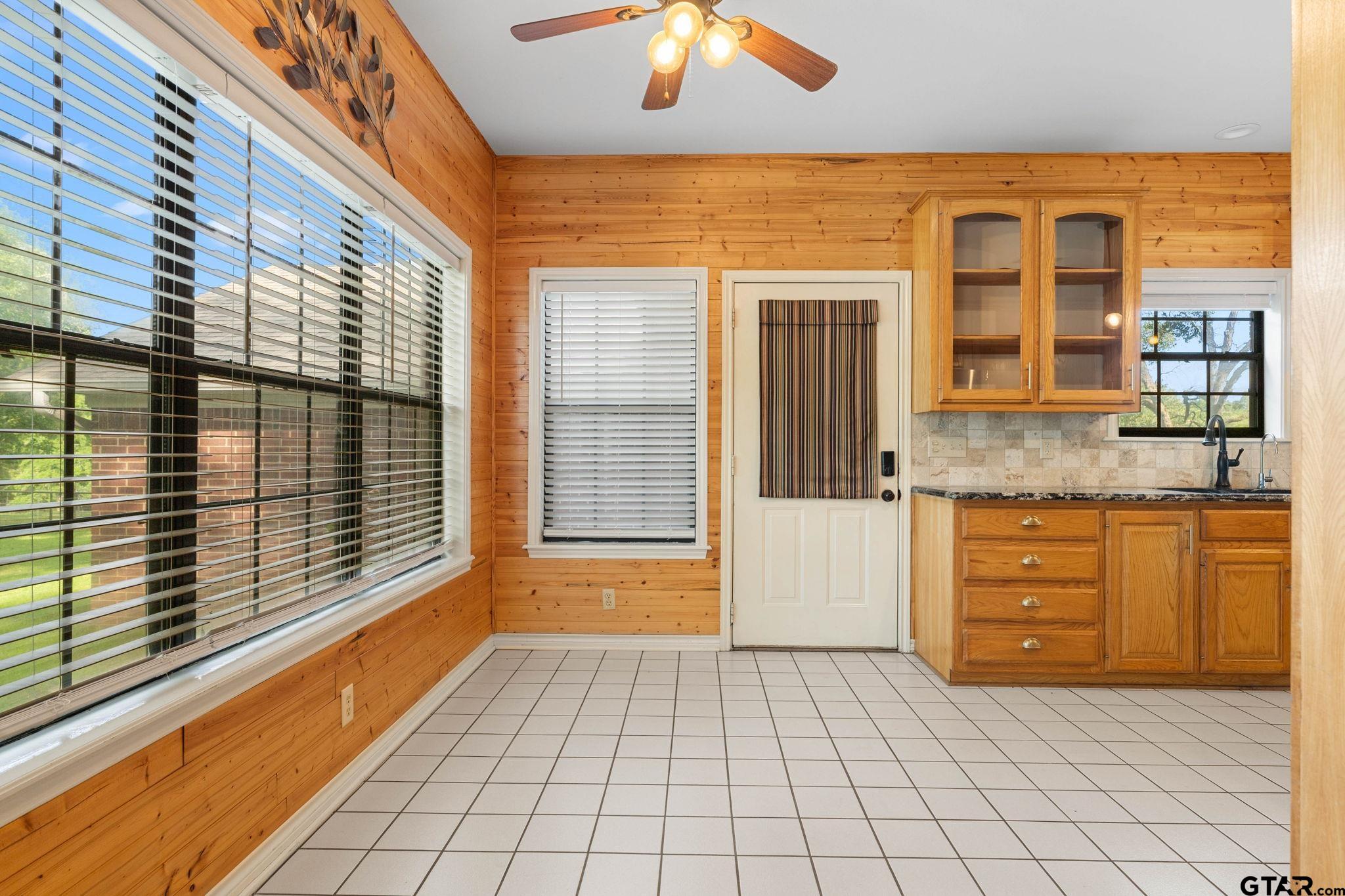 12450 County Road 420 Tyler, TX 75704 - Photo 11 of 48 a view of a brick house with a large windows