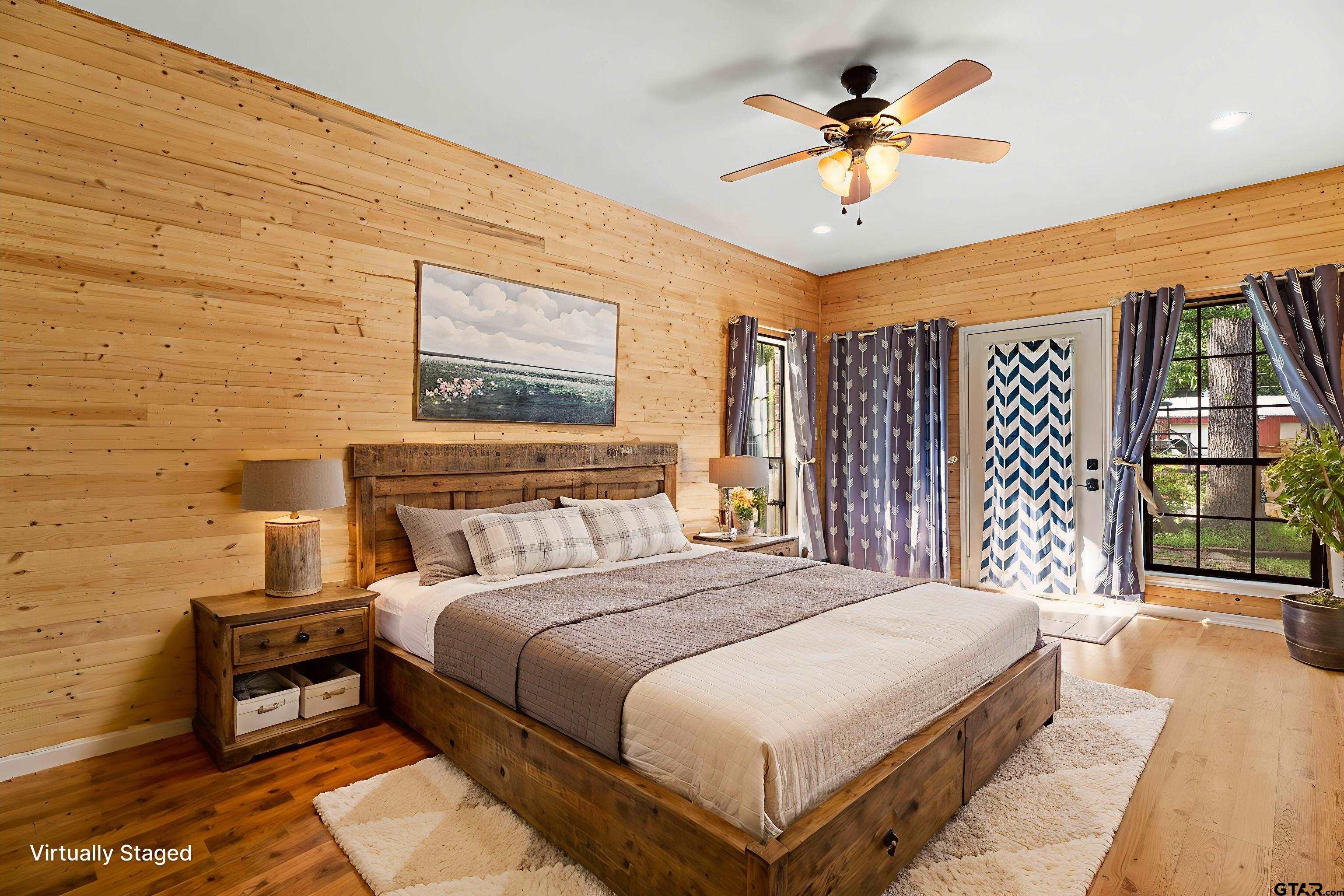 12450 County Road 420 Tyler, TX 75704 - Photo 16 of 48 a bedroom with a bed and a chandelier