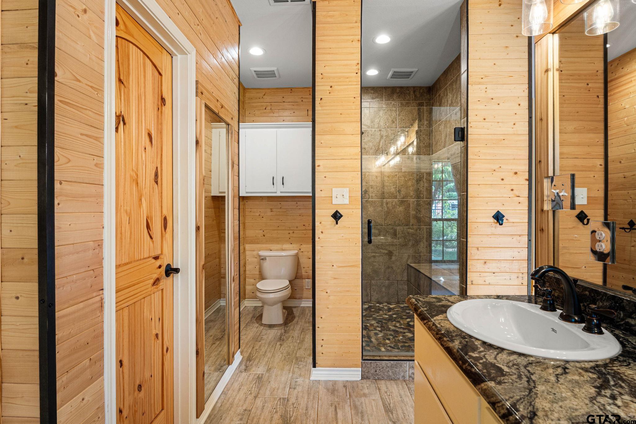 12450 County Road 420 Tyler, TX 75704 - Photo 20 of 48 a bathroom with a sink a toilet and shower