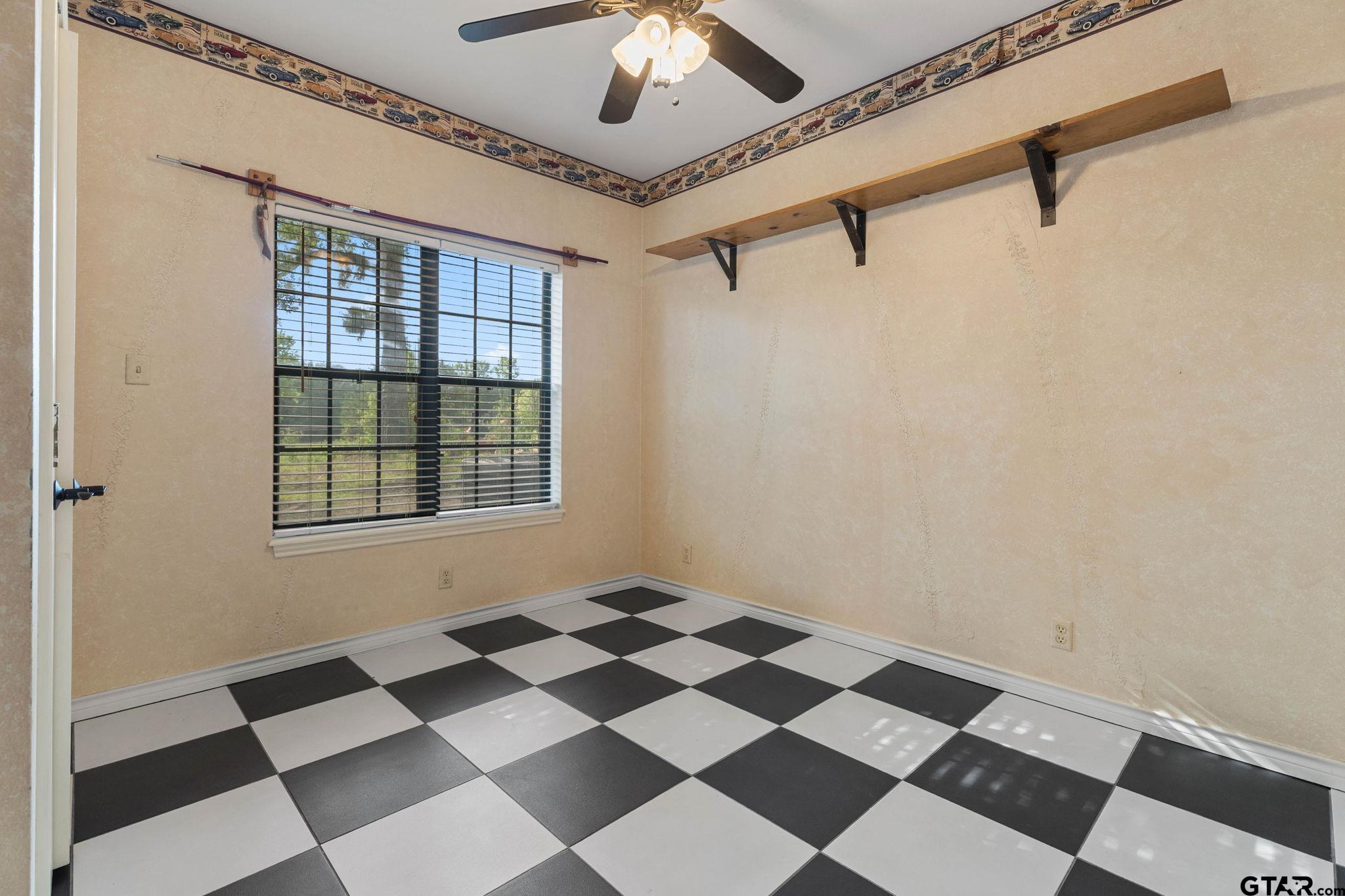 12450 County Road 420 Tyler, TX 75704 - Photo 31 of 48 a black and white checkered floor