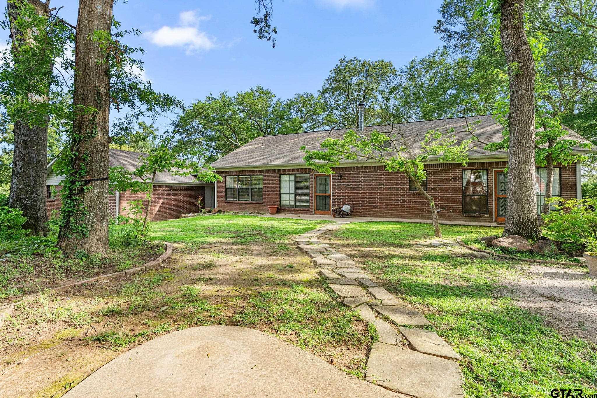 12450 County Road 420 Tyler, TX 75704 - Photo 37 of 48 front view of a house with a yard