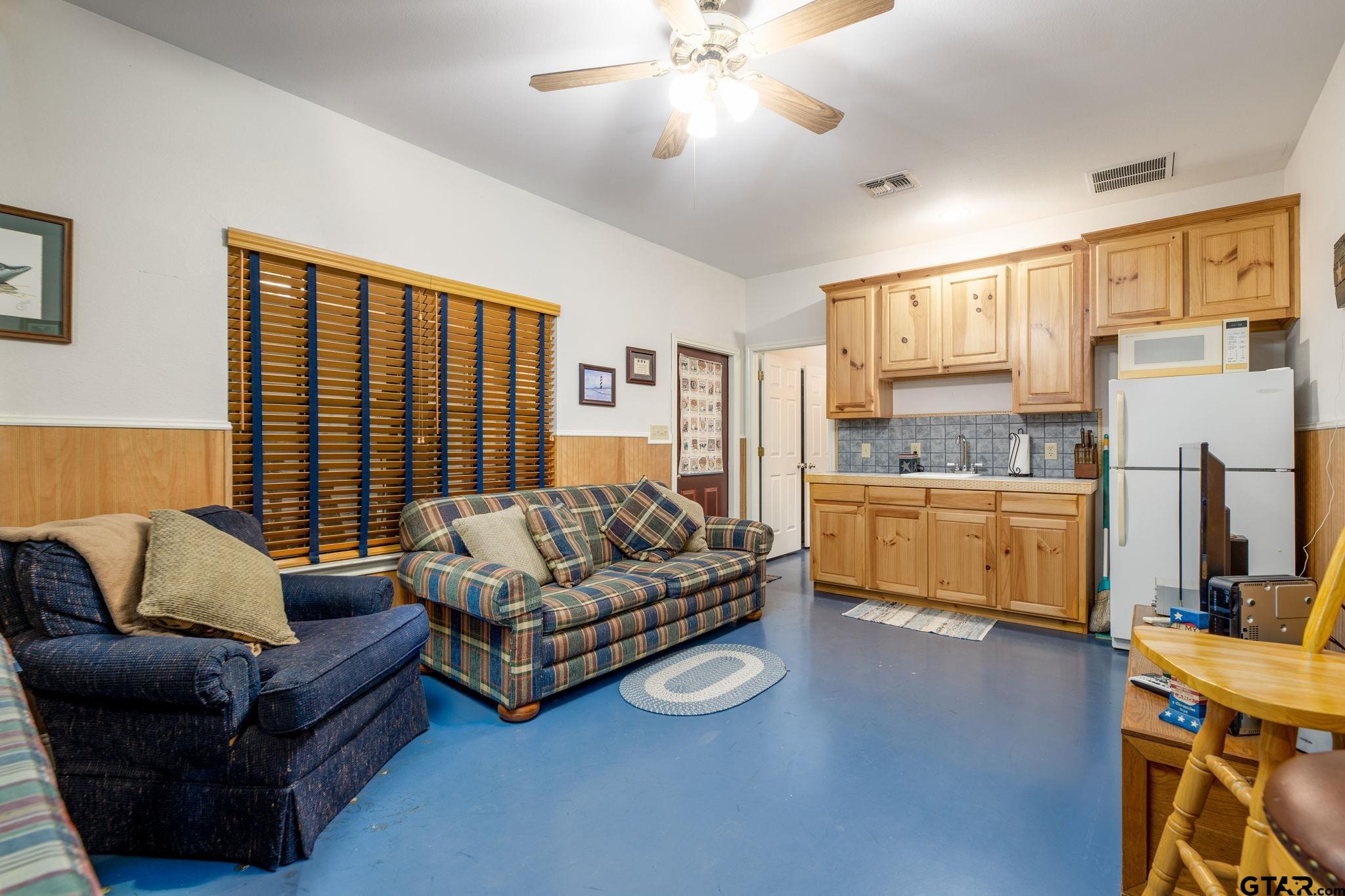 12450 County Road 420 Tyler, TX 75704 - Photo 39 of 48 a living room with furniture and a large window