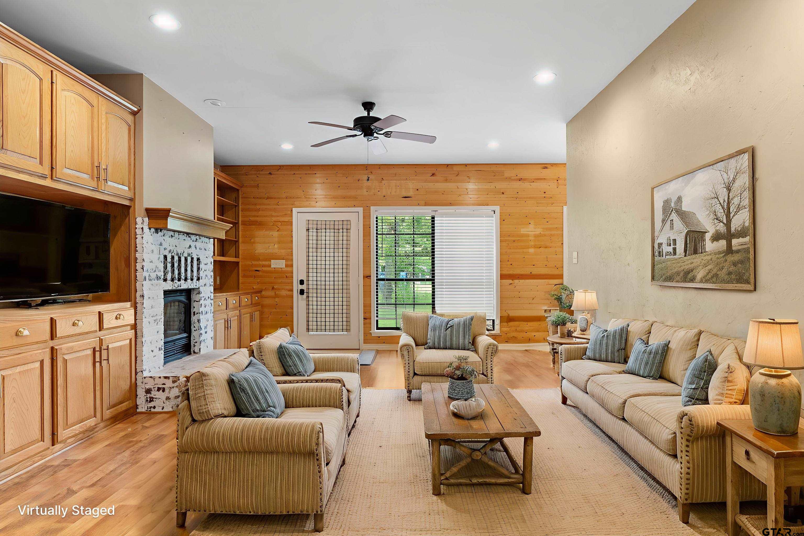 12450 County Road 420 Tyler, TX 75704 - Photo 9 of 48 a living room with furniture ceiling fan and a flat screen tv