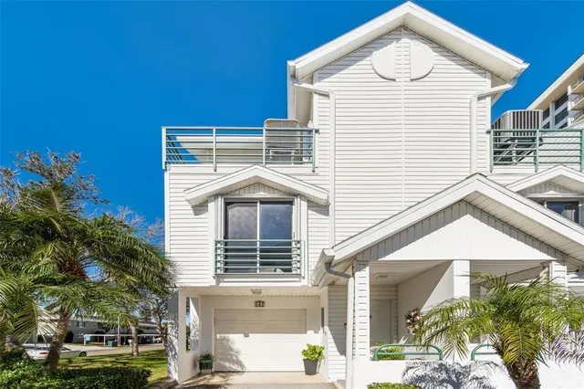 a view of a white house with a large windows