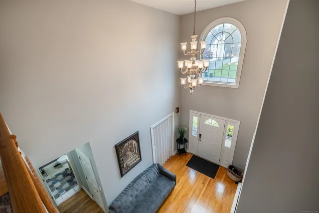 a view of an entryway with wooden floor