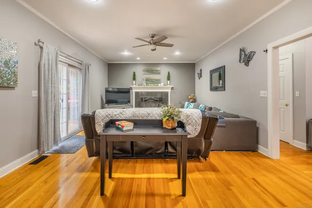 a view of a dining room with furniture and wooden floor