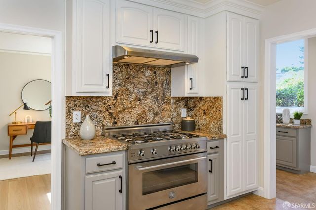 a view of hall way with furniture and entryway