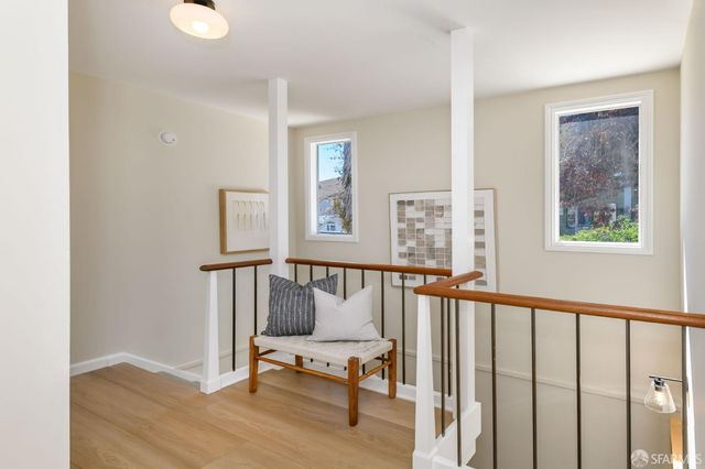 a spacious bedroom with a bed a couch and a window