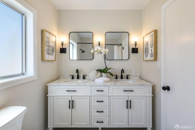 a bathroom with a bathtub and shower