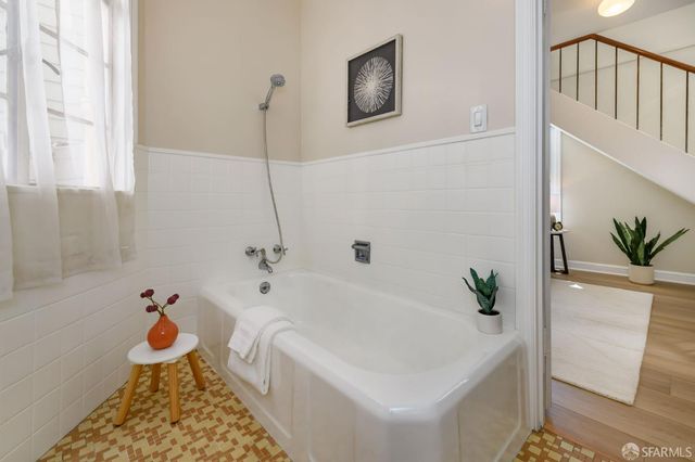 a view of a patio with table and chairs and potted plants