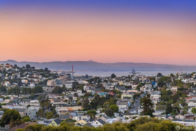 a view of a park with large trees