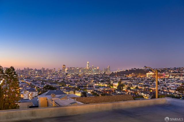 a large building with trees in front of it