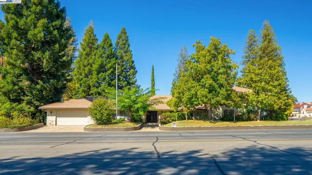 a view of a house with a street
