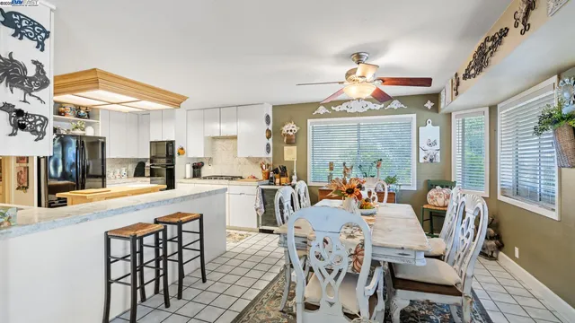 a view of a dining room with furniture window and outside view