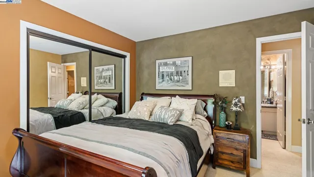 a bedroom with a bed and a desk