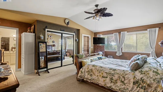 a bedroom with a bed furniture and window